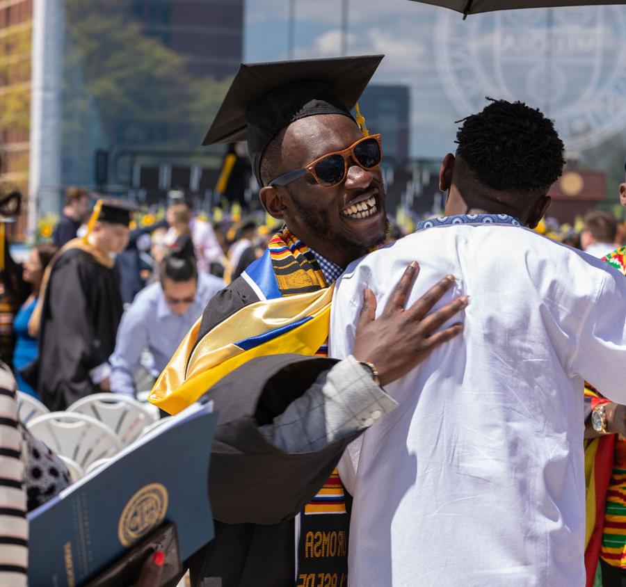 Students celebrating academic success at the UNiversity of Rochester Commencement Ceremony.